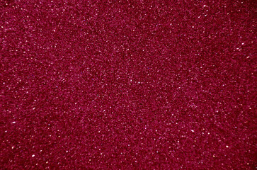 Burgundy blurred background with sparkles for text.