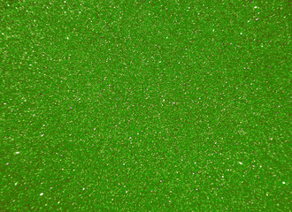 Green blurred background with sparkles for text.