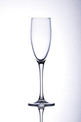 Empty wine glass on white background.