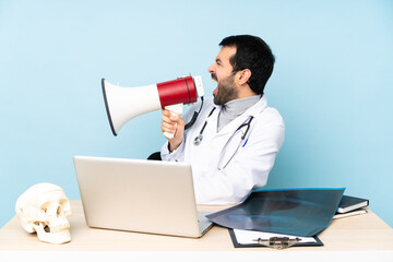 Professional traumatologist in workplace shouting through a megaphone