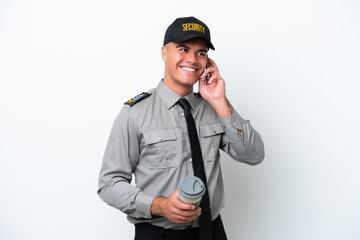 Young caucasian security man isolated on white background holding coffee to take away and a mobile