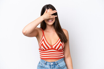 Young Brazilian woman isolated on white background covering eyes by hands and smiling