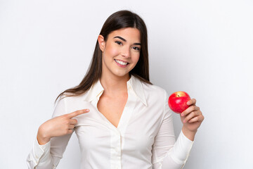 Young Brazilian woman with an apple isolated on white background with surprise facial expression