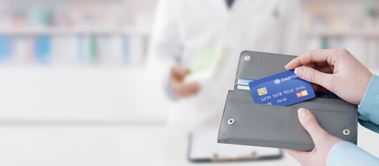 Woman buying prescription medicines in the pharmacy