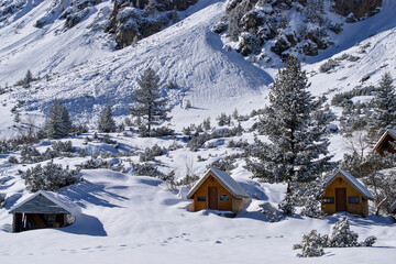wooden cabins in the mountain during winter