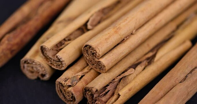 thin real cinnamon close-up, fragrant fresh cinnamon in twisted sticks