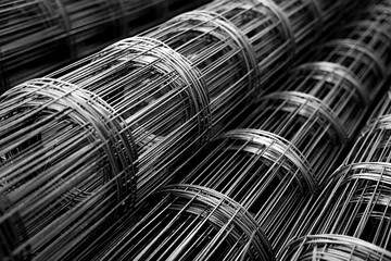 A rolls of wire mesh in the showroom of a large store.