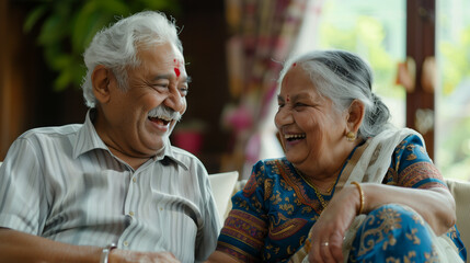 Two elderly Indian people talking and laughing together. - obrazy, fototapety, plakaty