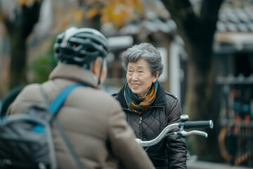 Obraz premium Senior woman with electric bicycle smiling while looking at man