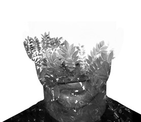 A black and white double exposure male portrait disappearing to the background