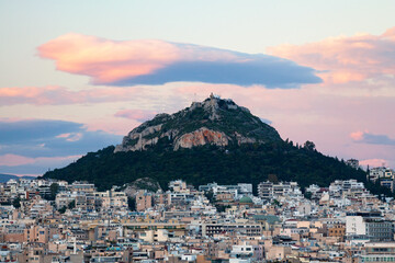 Cityscape of Athens and the Mount Lycabettus at sunset