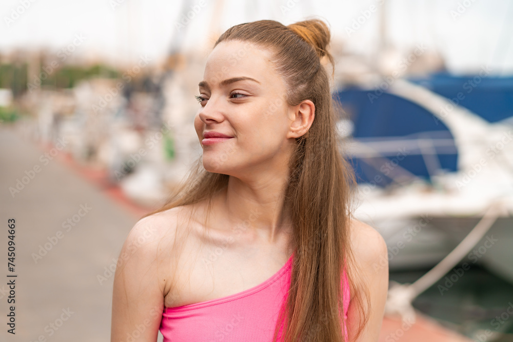 Wall mural Young pretty sport girl at outdoors . Portrait