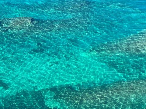 Blue sea lagoon water clear surface aqua background.