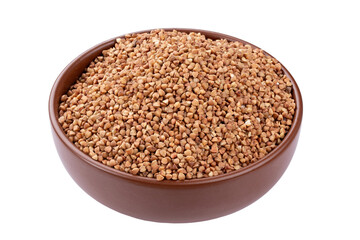 Green buckwheat grain in clay bowl isolated on white background. File contains clipping path.