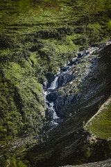 Fototapeta na wymiar Waterfall in the mountains in Norway.