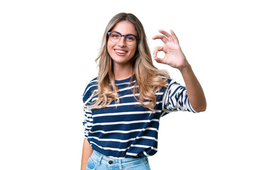 Young Uruguayan woman over isolated background showing ok sign with fingers