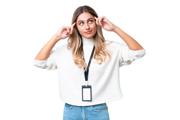 Young Uruguayan woman with ID card over isolated background having doubts and thinking