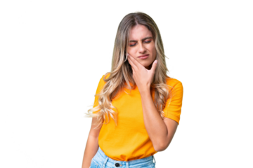 Young Uruguayan woman over isolated background with toothache