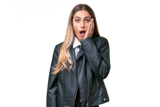 Business pretty Uruguayan woman wearing a biker jacket over isolated background with surprise and shocked facial expression