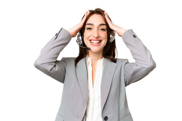 Telemarketer caucasian woman working with a headset over isolated chroma key background with surprise expression
