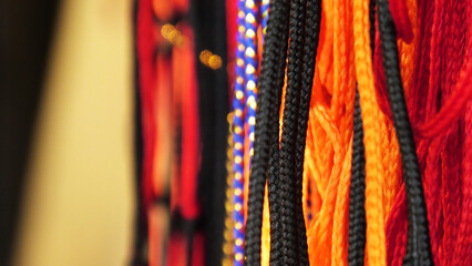 In a shop selling colorful thread strings used for spiritual purposes