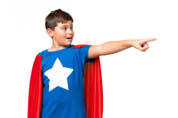 Super Hero caucasian kid over isolated chroma key background pointing away