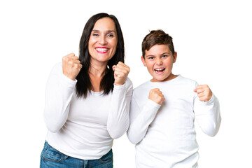 Little caucasian kid over isolated chroma key background celebrating a victory