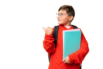 Little caucasian student kid over isolated chroma key background pointing to the side to present a product