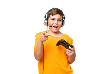 Little caucasian kid playing with a video game controller over isolated chroma key background...