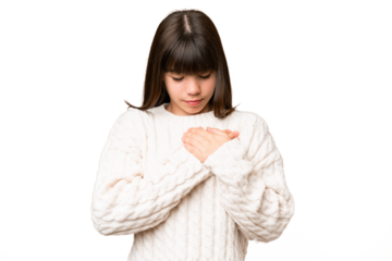 Little caucasian girl over isolated background having a pain in the heart