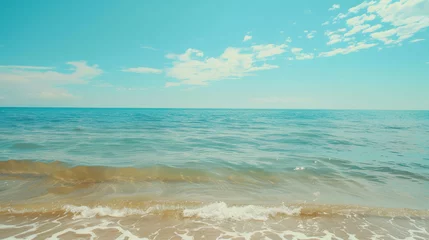 Fototapeten Serene Beachside Horizon under Clear Blue Skies, Calm turquoise sea meets a clear sky, gentle waves lapping sandy shore © Martí