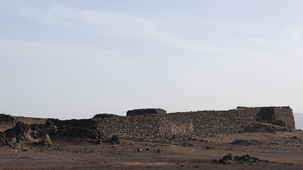 Barren hills and stone ruins on the edge of Las Palmas in the Canary islands, Spain.