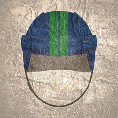 Ice hockey helmet textured by Vancouver Canucks team uniform colors. Concrete wall grunge texture