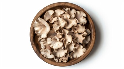 King Oyster mushroom or Eringi in wooden bowl isolated on white background. Top view. Flat lay