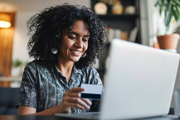 girl using her credit card to buy with her laptop - obrazy, fototapety, plakaty