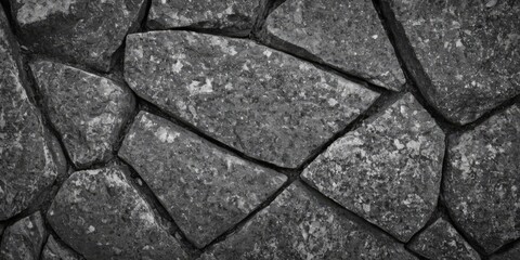 Black white stone texture. Rock surface. Close-up. Like a old rough concrete wall. Dark gray grunge background with space for design
