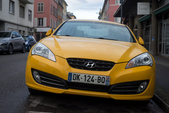 Mulhouse - France - 25 february 2024 - Front view of yellow hyundai coupe parked in the street