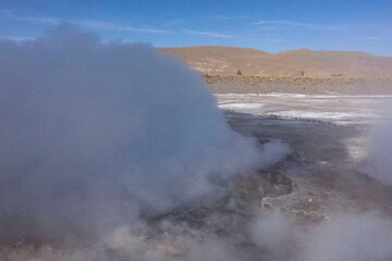 Tatio Geysers in San Pedro de Atacama, Chile, South America. Dramatic volcanic hot springs with rising water and steam