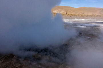 Tatio Geysers in San Pedro de Atacama, Chile, South America. Dramatic volcanic hot springs with rising water and steam
