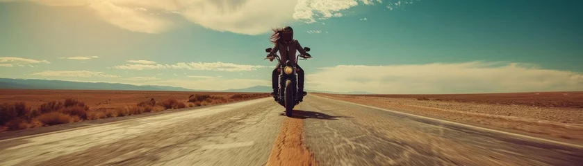 Tuinposter open road, the motorcyclist embraces the exhilarating freedom of the journey. With the powerful roar of the motorcycle engine and the wind rushing past © Thares2020