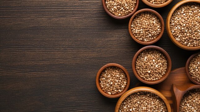 Buckwheat in a wooden bowl with a spoon on a wooden background. The concept of healthy eating. Buckwheat contains a large amount of vitamins and minerals. © Cherkasova Alie