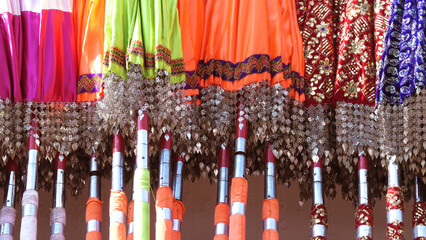 Multi colored decorated parasols kept for festival use