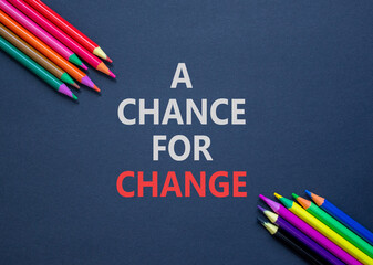 Fototapeta na wymiar A chance for change symbol. Concept words A chance for change on beautiful black paper. Beautiful black background. Colored pencils. Business A chance for change concept. Copy space.