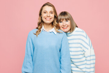 Elder parent mom 50s years old with young adult daughter two women together wear blue casual...