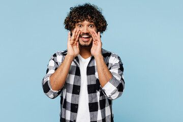 Young Indian man he wears shirt white t-shirt casual clothes scream sharing hot news about sales...