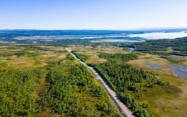 Aerial view of street leading through beautiful landscape and nature near Handöl