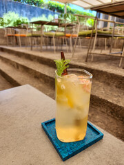 Orange juice in glass. Fresh fruits on wooden background