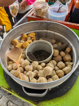 Pentol is a type of snack which can be found in Indonesia. it's a type of beef meatballs with flour, usually given with peanut sauce and sambal. Bakso or baso is an meatball from indonesia.
