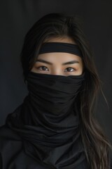 Fototapeta premium Japanese woman ready for battle in a black ninja hood, capturing the essence of prowess and stealth in the art of combat. Generative AI.