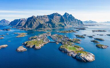Lofoten highlight and tourist attraction Henningsvaer seen from the air at a beautiful summer day